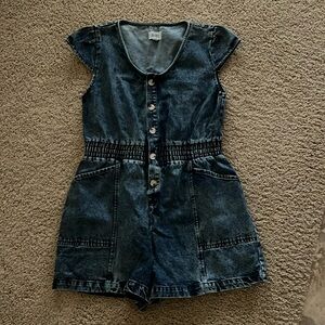NWOT- Denim romper with buttons, elastic waist and pockets. Size L. Never worn.